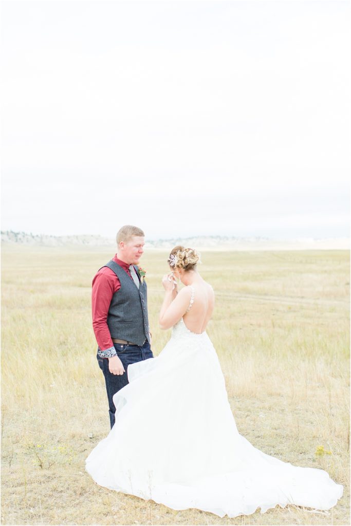 Burgundy & Orange Wyoming Wedding Fall Inspired Bride and Groom First Look